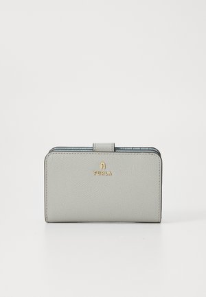 Light gray leather wallet with a textured finish, featuring a gold logo and a flap closure. Compact rectangular shape.