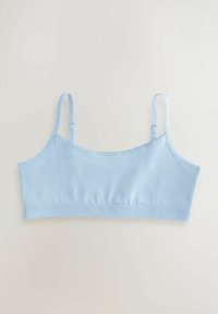 Soutien-gorge en coton bleu clair avec bretelles réglables, design sans coutures et texture douce. Présente un tissu uni sans motifs ni accents.