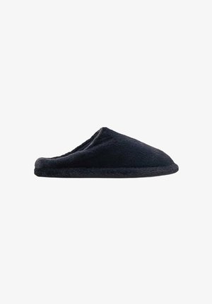 Sort fleece-selvskot med lukket bag, rund tå og blød tekstur. Har en tyk sål og et sømløst overdel-design.