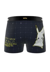 Caleçons noirs avec un motif en grille, logo Pokémon sur la ceinture, graphique de Pikachu, et texte jaune avec "Attrapez-les tous Pikachu #025."