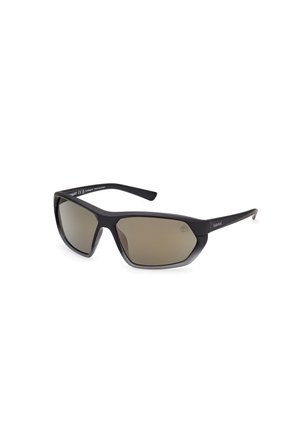 Schwarze Plastiksonnenbrille mit grauen Verlaufslinsen, eckigem Design und schlanken Bügeln. Besitzt ein dezentes Markenlogo an der Seite.