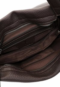 Brown leather handbag with a textured finish. Features multiple interior zippered compartments and a smooth fabric lining.