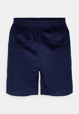 Temno modri kordurojski šortji z elastičnim pasom. Imajo vertikalno rebrasto teksturo, ravno krojno linijo in nimajo vidnih žepov ali okrasnih elementov.