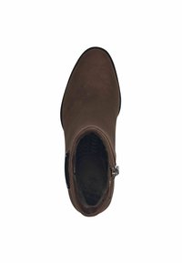 Brown ankle boot made of smooth material, with a rounded toe, decorative side zipper, and soft interior lining. Flat sole design.