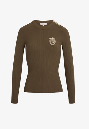 Olive green ribbed knit long-sleeve top with round neckline, three decorative gold buttons on left shoulder, and gold embroidered crest on chest.