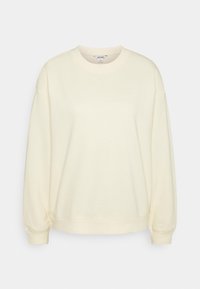 Bluza w kolorze kremowym z okrągłym dekoltem i ściągaczami na rękawach. Posiada luźny krój i miękką fakturę materiału, bez widocznych wzorów.