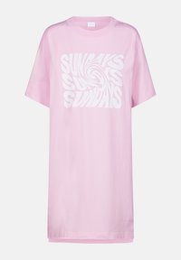 T-shirt surdimensionné rose en coton, présentant un design graphique en spirale avec un texte blanc qui dit "SUNDAYS" répété plusieurs fois.