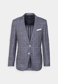 Marinblå blazer med rutmönster, två knappar, snittade slag och en vit fickruta. Strukturerad tyg med skräddarsydd passform.