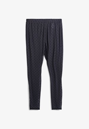 Leggings neri trasparenti con piccoli pois in velluto su tutta la superficie e vita elasticizzata, disposti su uno sfondo bianco.
