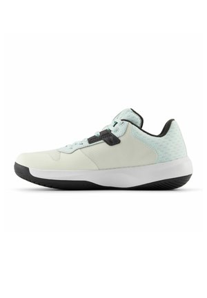 Low-top athletic shoe in light mint and cream with black sole and lace-up closure, designed for comfort and casual wear.
