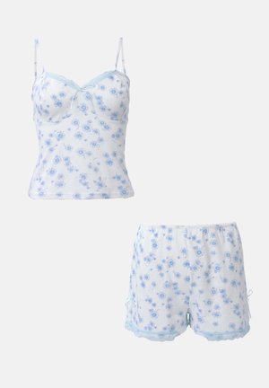 Set di canotta e pantaloni corti con stampa floreale in azzurro chiaro e bianco. Realizzato in tessuto morbido, presenta un delicato pizzo e spalline regolabili sulla canotta.