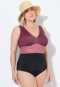 Maillot de bain une pièce bordeaux et noir. Présente des accents dorés, un décolleté en V et un design ajusté avec une bande contrastante à la taille.