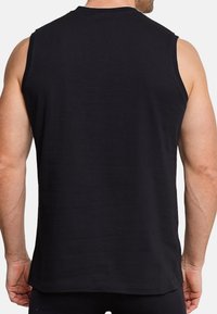 Zwarte mouwloze katoenen tanktop met een ronde halslijn, met een stevige textuur en een rechte zoom op de taille.