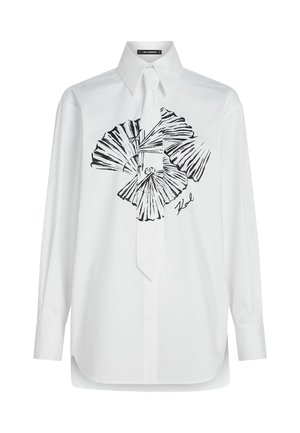 Biała koszula z długim rękawem z czarnym abstrakcyjnym wzorem na przodzie, z kołnierzykiem w szpic i pasującym krawatem.