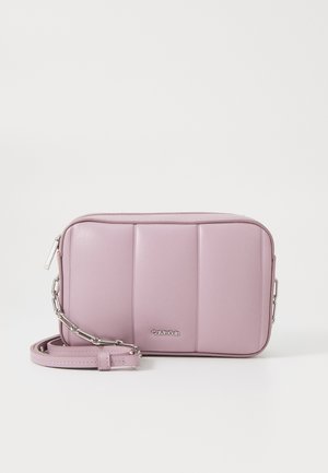 Calvin Klein pink faux leather crossbody bag, featuring quilted design, silver chain accent, and adjustable strap. Rectangular shape.