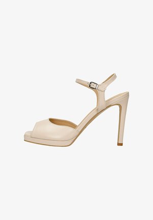 Sandale beige à talon haut ouvert avec bride à la cheville et boucle, talon aiguille fin, et légère semelle plateforme.