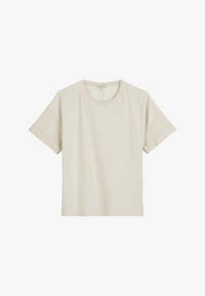 Beżowa bawełniana koszulka z okrągłym dekoltem, krótkimi rękawami i luźnym krojem. Materiał jest miękki o gładkiej fakturze z podwiniętymi mankietami rękawów.