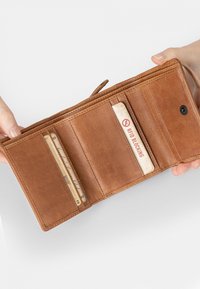 Brown leather wallet featuring multiple card slots, a smooth texture, and an RFID blocking card with a red prohibition symbol.