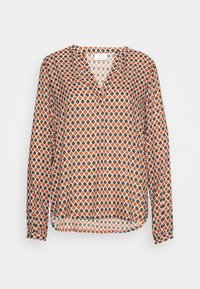 Blouse à manches longues orange, marron et blanc avec un motif géométrique en losanges, dotée d'un col en V et d'une coupe décontractée. Tissu léger.