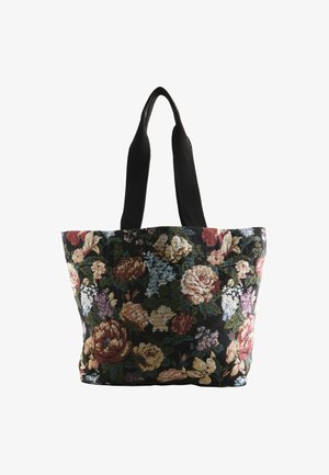 Florale Wandteppich-Tragetasche mit schwarzem Hintergrund, versehen mit mehrfarbigen Rosen und anderen Blumen. Schwarze Stoffriemen zum Tragen.