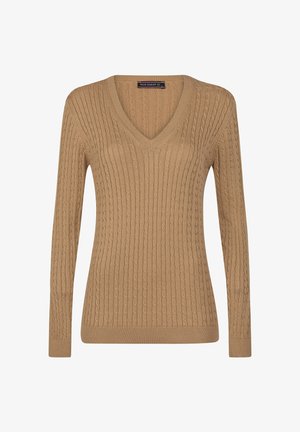 V-hals, lange mouwen trui in een tan kleur. Heeft een geribbelde textuur met kabelbreipatroon en aansluitende mouwen en zoom.