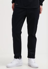 Nike SB Tygbyxor - black