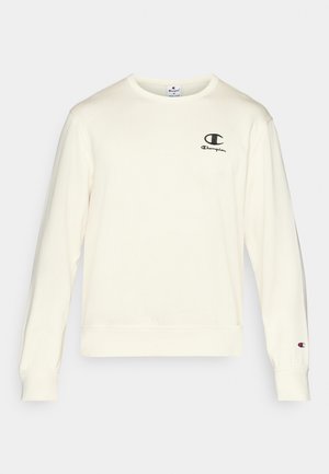 Cremefarbener Sweatshirt aus Baumwolle mit langen Ärmeln, gerippten Bündchen und kleinem schwarzem Champion-Logo auf der linken Brust.
