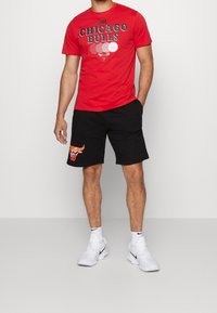 New Era Krótkie spodenki sportowe