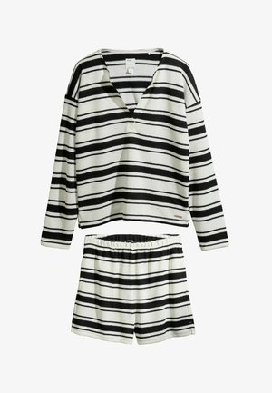 Black and white horizontal striped long-sleeve top with V-neck paired with elastic waist shorts in matching stripes.