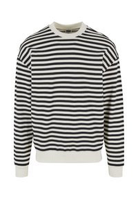 Pruhovaná mikina v námořnické modři a krémové barvě, s dlouhými rukávy, kulatým výstřihem a žebrovanými manžetami a lemem. Vyrobena z měkké bavlněné látky.