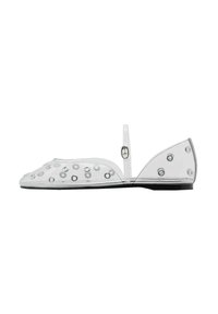 Transparent flat shoe with round cutouts, a small back strap, and a black sole. Features a smooth texture and minimalist design.