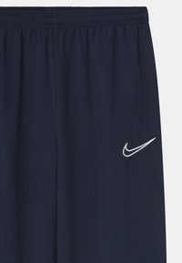 Nike Performance UNISEX - Teplákové kalhoty - obsidian/white