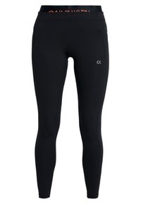 Leggings neri con una texture liscia, caratterizzati da un logo Calvin Klein arancione a contrasto sulla cintura e un piccolo logo CK sulla gamba.
