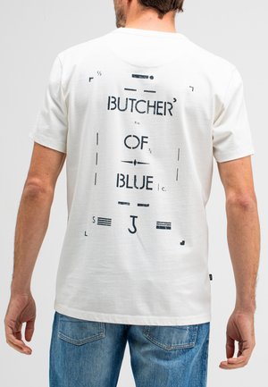 T-shirt en coton blanc avec un texte graphique noir au dos. Col rond, manches courtes et coupe décontractée.