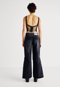 The Ragged Priest FERAL ZIP FLARES - Wide Leg - charcoal