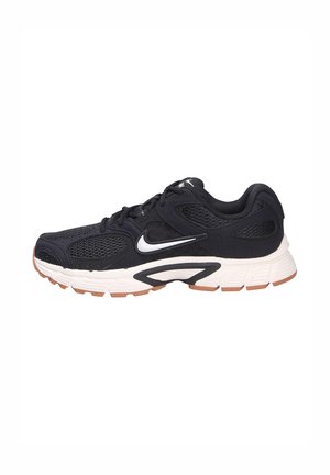 Scarpa da corsa Nike bianca e nera con tomaia in mesh, chiusura con lacci, suola ammortizzata e battistrada marrone su sfondo bianco.
