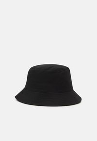 Black bucket hat made of fabric with a round crown, wide, downward-curving brim, and subtle stitching along the edge.