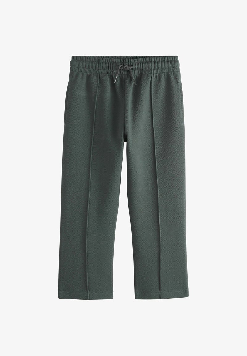 Dunkelgrüne Jogginghosen mit Kordelzug, elastischem Bund, Bügelfalten vorne, verkürzter Länge und Seitentaschen, dargestellt vor weißem Hintergrund.