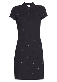 Marinblå polo klänning i bomull, med krage, korta ärmar och utspridda små broderade röda och vita detaljer.