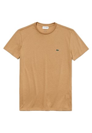 Braunes Baumwoll-T-Shirt mit kurzen Ärmeln, Rundhalsausschnitt und kleinem grünen gestickten Krokodil-Logo auf der linken Brust. Sanfte Textur.