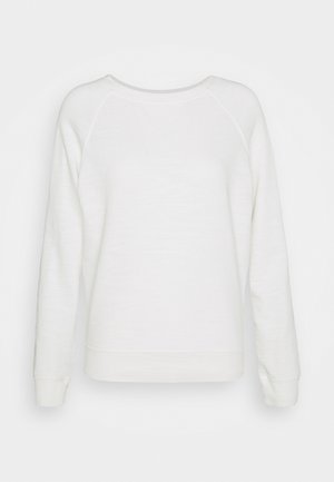 Biała bluza z długim rękawem i okrągłym dekoltem, z raglanowymi rękawami oraz ściągaczami na mankietach i dole, prezentowana na jednolitym tle.