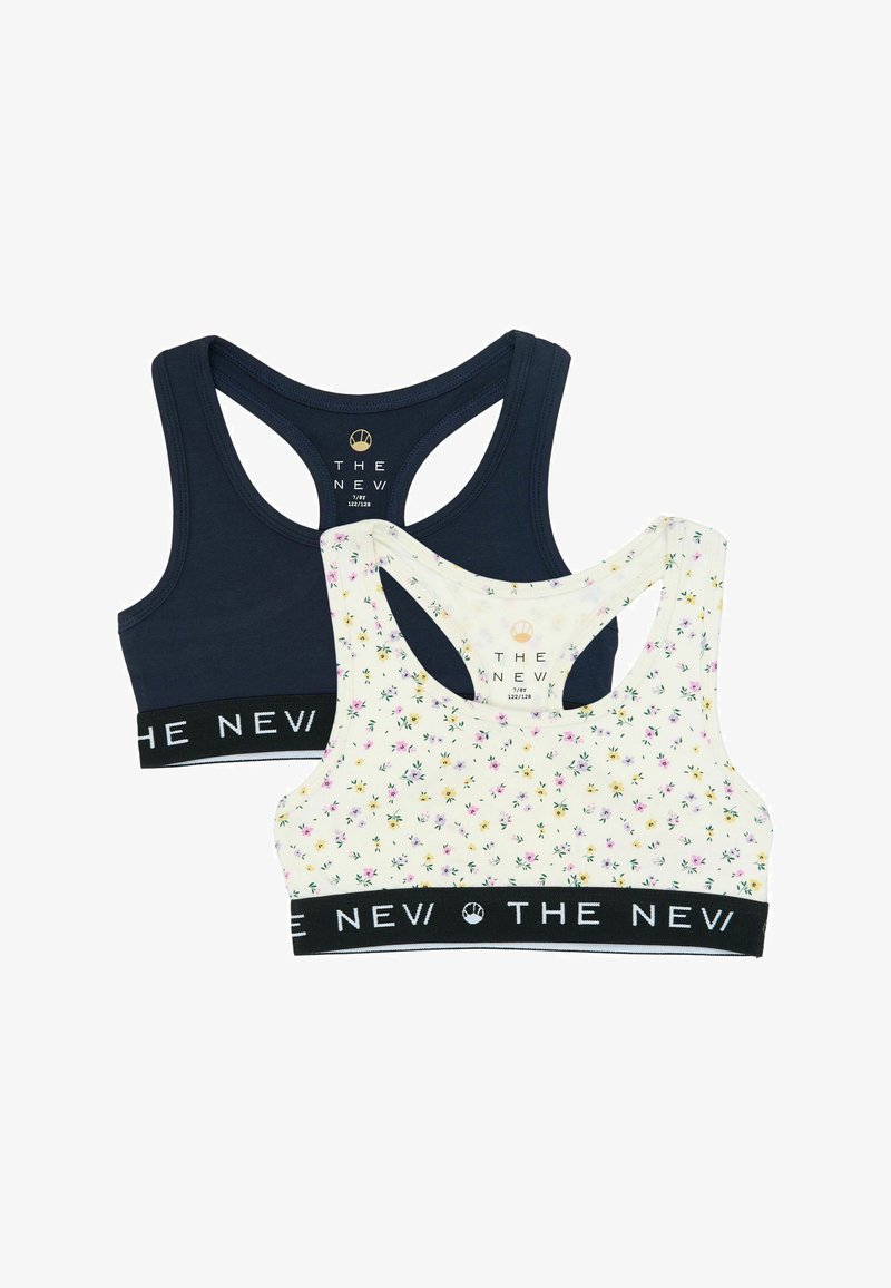 Dve športové podprsenky s otvoreným chrbtom, jedna tmavomodrá a druhá biela s malými ružovými a žltými kvetmi, obe s čiernymi elastickými pásmi označenými nápisom "THE NEV".