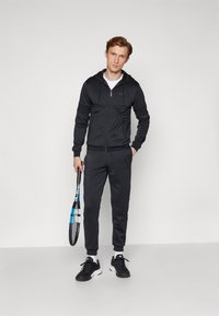 Sergio Tacchini MORET PANTS - Treniņtērpa apakšdaļas - black