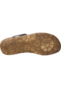 Gummisohle mit floralem Muster und strukturiertem Oberfläche, in Braun gehalten und mit eingraviertem Markennamen für besseren Halt.