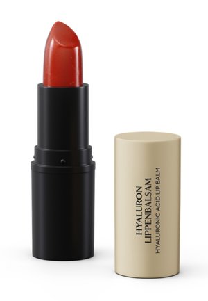 Red hyaluronic acid lip balm in black tube with beige cap labeled "Hyaluron Lippenbalsam."
