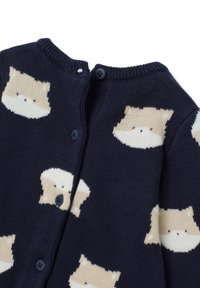 Cárdigan de punto en color marino con motivos de gatos beige, cuello redondo y cierre de botones. Textura suave con un acabado de punto liso.