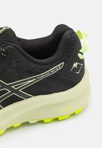 ASICS TRABUCO TERRA 2 - Chaussures de running - black/cool matcha