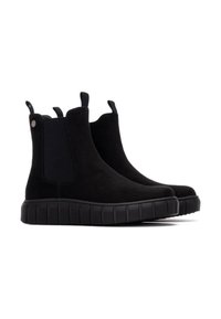 Botines de ante negros con paneles laterales elásticos, diseño fácil de poner y suela de goma gruesa con un patrón estriado y tiradores.
