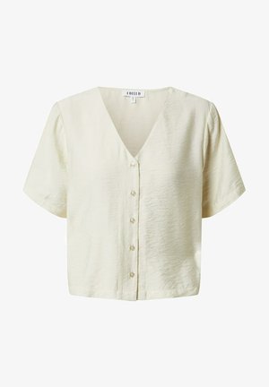 Crème-kleurige blouse met korte mouwen, een V-hals en knopen aan de voorkant. Zachte, gestructureerde stof met een ontspannen, boxy vorm.