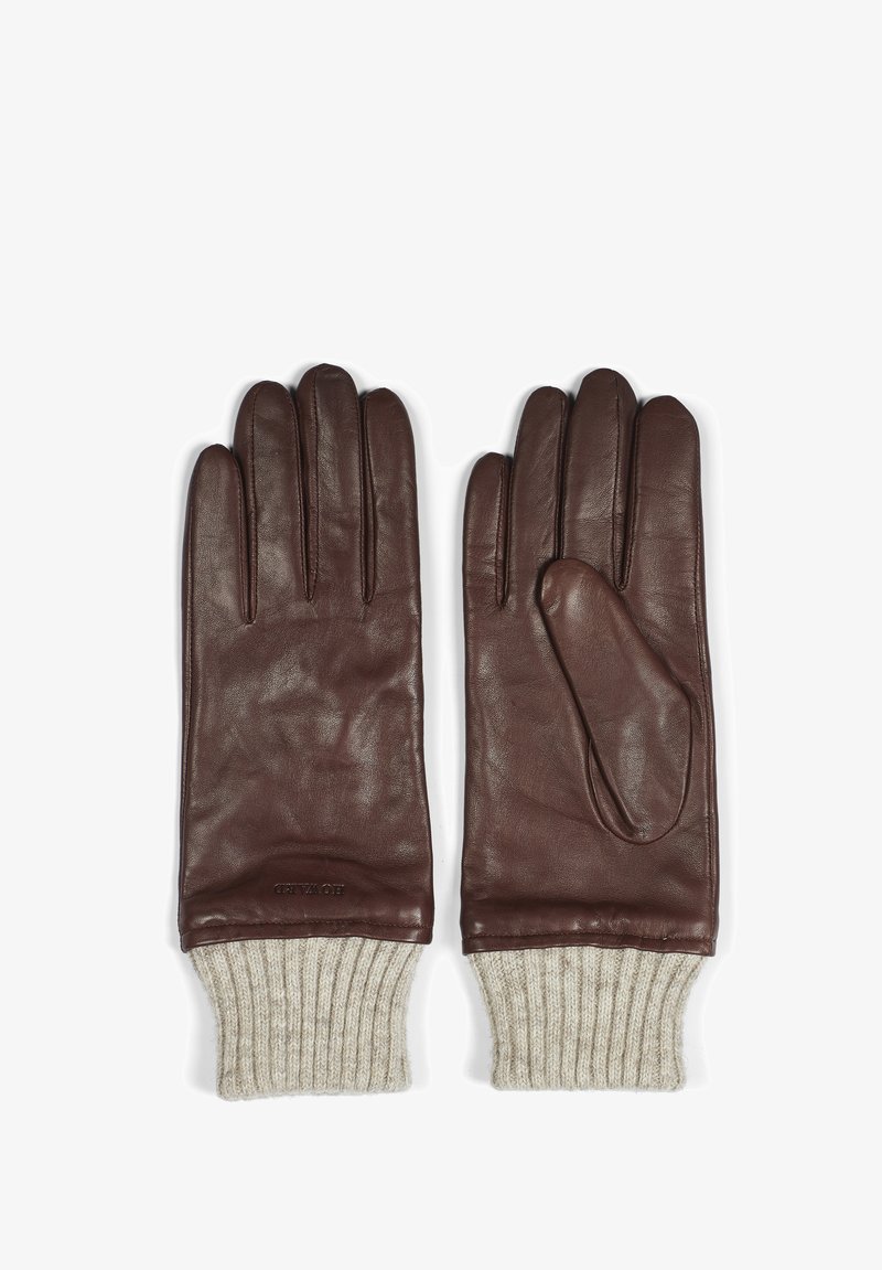Bruna läderhandskar med en slät yta, med ribbade beige stickade manschetter. Stilig sömnad och en spetsig fingerdesign.
